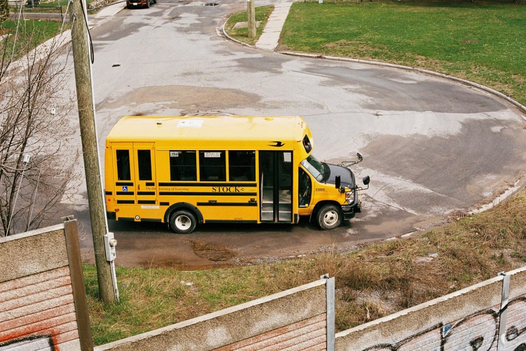 School Bus Accident Lawyer in Bellerose – yellow school bus parked on a city street
