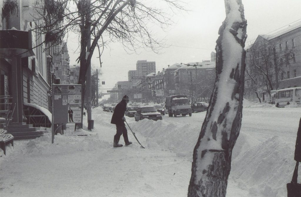 Slip and Fall Accident Lawyer in Bellerose – person shoveling snow from a sidewalk