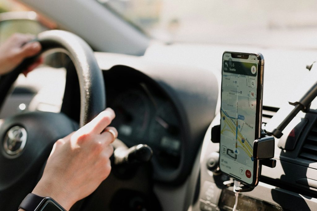 Uber Passenger Accident Lawyer in Bellerose – passenger using a phone