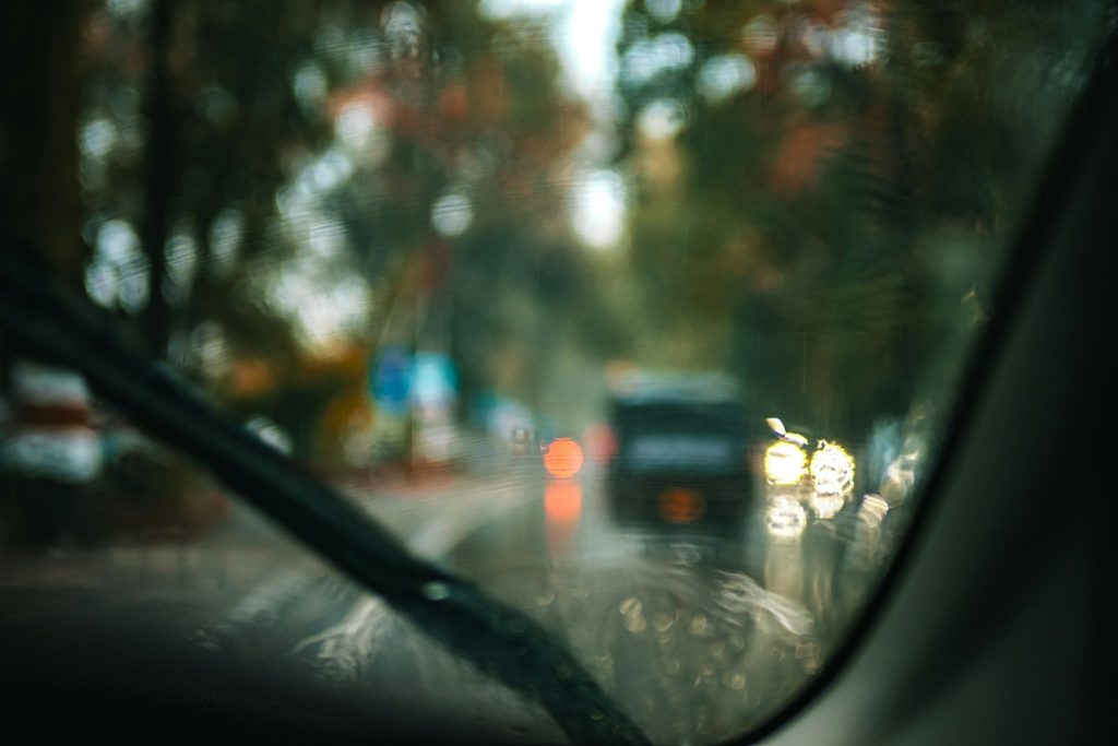 Uber Passenger Accident Lawyer in Bellerose – view through a rainy windshield